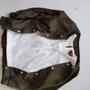 Olive green jacket and white shirt.